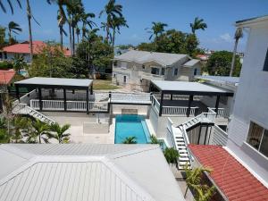 an aerial view of a house with a swimming pool at The Great House Inn in Belize City