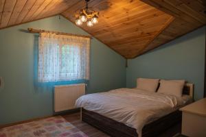 Postel nebo postele na pokoji v ubytování Petra Suit Bungalov & Villa