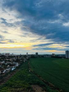 a view of a city with a field and buildings at Flat 912 Super Aconchegante! in Ribeirão Preto