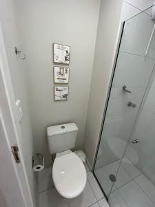 a bathroom with a toilet and a shower at Travellar Spot 912 in Ribeirão Preto +7 photos