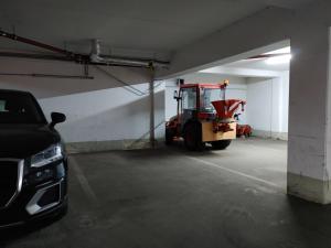 a large garage with a forklift parked in it at Haus Blumenampel in Schmalkalden