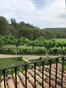 a view of a garden from a balcony at Allotjament Rural Solsona in Solsona