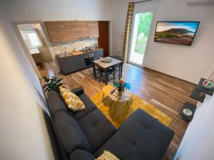 an overhead view of a living room with a couch and a table at Alessandra's apartment in Sassari