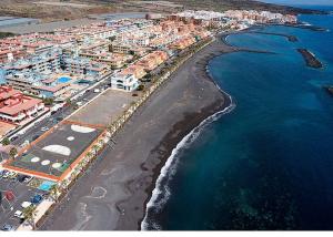 an aerial view of a beach next to the ocean at Muy cómodo y cerca de la playa Supreme Puertito 7 in Puertito de Güímar