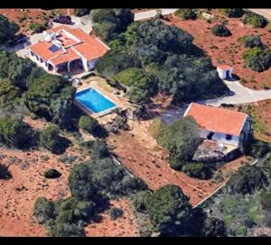 an aerial view of a house with a swimming pool at Fado in Almancil