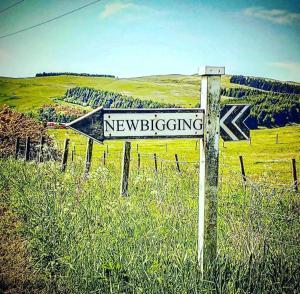 a sign that says newbreeding on top of a field at The Wee Stay - Room Only - Rural 1 Bed Guest Suite in Middleton Fossoway