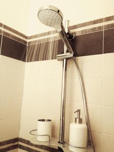 a shower head in a bathroom with a toilet at B&B Day by day in Iseo