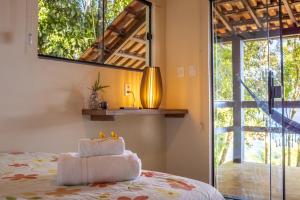 Cama ou camas em um quarto em Pousada Lagamar