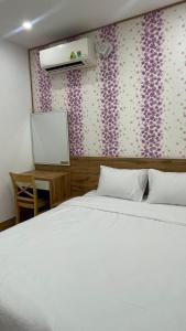 Giường trong phòng chung tại KIM HOUSE