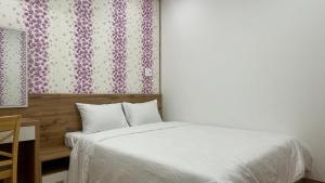 Giường trong phòng chung tại KIM HOUSE