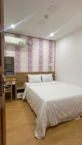 Giường trong phòng chung tại KIM HOUSE