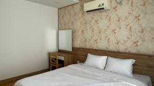 Giường trong phòng chung tại KIM HOUSE