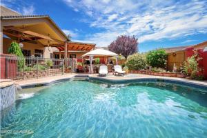 a swimming pool in the backyard of a house at Large Sedona Property with Private Pool! 7 Bedrooms! in Sedona