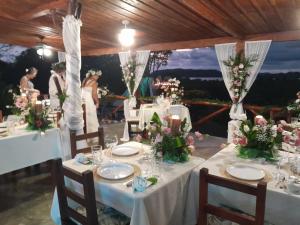 a table set up for a wedding with flowers at La Puesta del Sol B&B in Carrillo