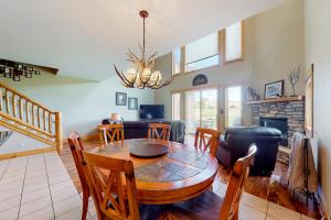 a living room with a table and a couch at San Juan Siesta in South Fork