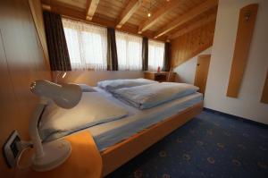 En eller flere senge i et værelse på Residence Villa Toni
