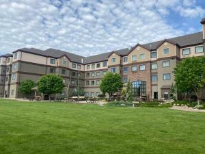a large building with a lawn in front of it at Staybridge Suites Great Falls, an IHG Hotel in Great Falls