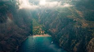 an aerial view of a lake in a canyon at Butterfly Valley Beach Glamping with Food in Oludeniz