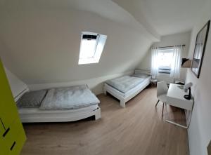 Postel nebo postele na pokoji v ubytování Ferienwohnung Mühlennest