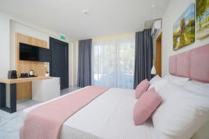 Posteľ alebo postele v izbe v ubytovaní Hotel ASTERA