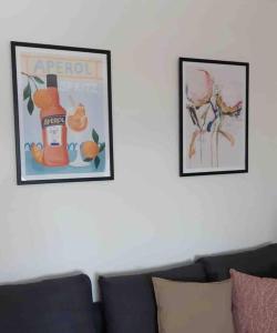 two framed pictures of a bottle of apple sauce on a wall at Nette Wohnung, 8 km RB Ring in Fohnsdorf