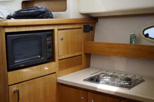 a kitchen with a stove and a microwave at Seacascais, Lda in Cascais +17 photos