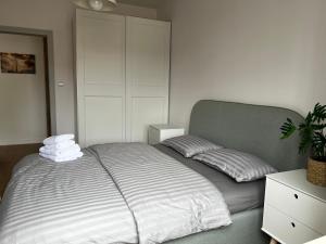 a bedroom with a large bed with two pillows at Apartament Iławka in Iława