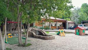 a playground with a slide at Hotel Edem in Karagandy