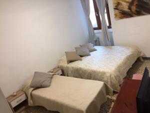 Postel nebo postele na pokoji v ubytování Dolce Lago