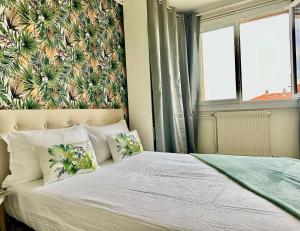 Postel nebo postele na pokoji v ubytování Grand appartement Bron centre proche Eurexpo et Groupama