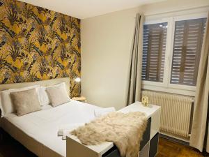 Postel nebo postele na pokoji v ubytování Grand appartement Bron centre proche Eurexpo et Groupama