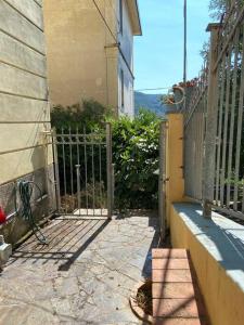 an entrance to a house with a metal gate at All’ombra delle sophore (011015-LT-2264) in La Spezia