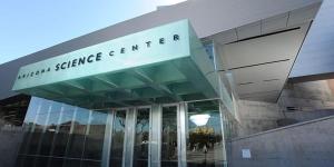 a building with a sign that reads human science centre at HEART OF DOWNTOWN HIGHRISE CITY VIEWS in Phoenix