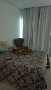 a bedroom with a bed with a rug on the floor at Casa Duplex - Garanhuns in Garanhuns