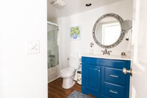 a bathroom with a blue cabinet and a sink at Rhett House in Beaufort