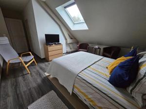 Comme à la maison客房内的一张或多张床位