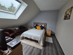 Comme à la maison客房内的一张或多张床位