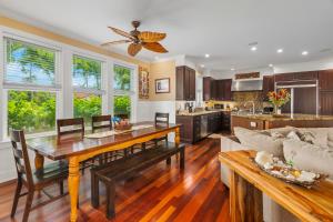 a kitchen and living room with a table and a couch at 1730 Kaleka 4 Bed Poipu House, Guest House walk to Beach in Koloa