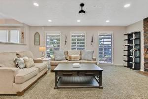 a living room with two couches and a coffee table at The Lucky 7 - Family Home in Quiet Meridian in Meridian