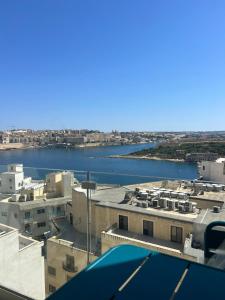 a view of a river from the roof of a building at Eleven by Warren Collection in Sliema