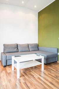 a living room with a couch and a coffee table at VDL Apartments in Trogir