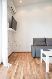 a living room with a couch and a table at VDL Apartments in Trogir