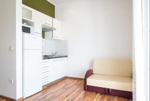 a living room with a couch and a kitchen at VDL Apartments in Trogir
