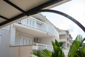 a view of a building with a balcony at VDL Apartments in Trogir