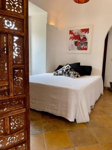 a bedroom with a bed in a room at Resort La Casa Dei Fiori in Pantelleria