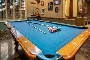 a pool table with balls on top of it at Quail Mountain Desert Resort: Heated Pool, Mt Vews, all BR's King & TV's, Hiking in Mesa