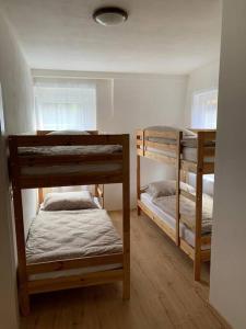 a room with three bunk beds in a room at Chalupa Krásný Buk, České Švýcarsko in Krásná Lípa +14 photos