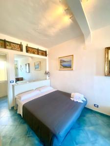 a bedroom with a large bed in a room at Casa Ignazia in Taormina