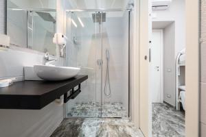 a bathroom with a sink and a shower at Elite del Centro Storico in Naples +46 photos