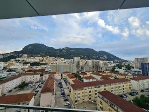 a view of a city with a mountain in the background at Luxury Apartment in Eurocity in Gibraltar